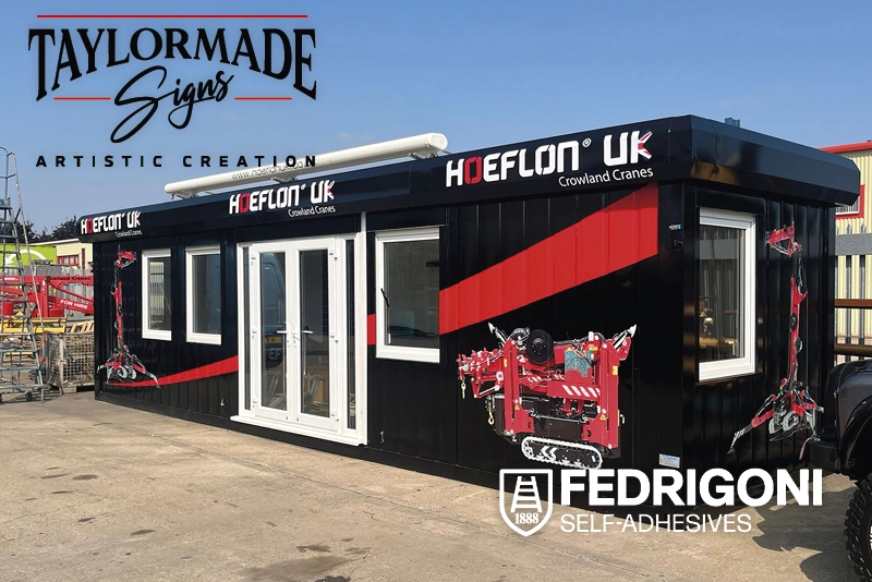 Fedrigoni P800 CAD sign vinyls applied to the exterior of a steel container that has been converted into a hosiptality unit and vinyl decorated by Taylormade signs. The design uses a black vinyl all over background with red swoosh shaped vinyl stripes and red and white cad-cut vinyl logos saying