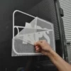 Peeling away RTape 4075 RLA application tape after the cutout van logo vinyl graphic and transfer paper have been wet applied to the side of the van. When the wet application method is used with this application paper it allows for easier final positioning and ease of removal of the transferring tape without disturbing the vinyl image.